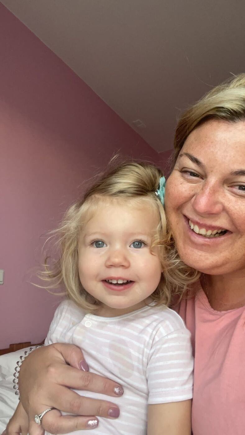 Delilah smiling with mum